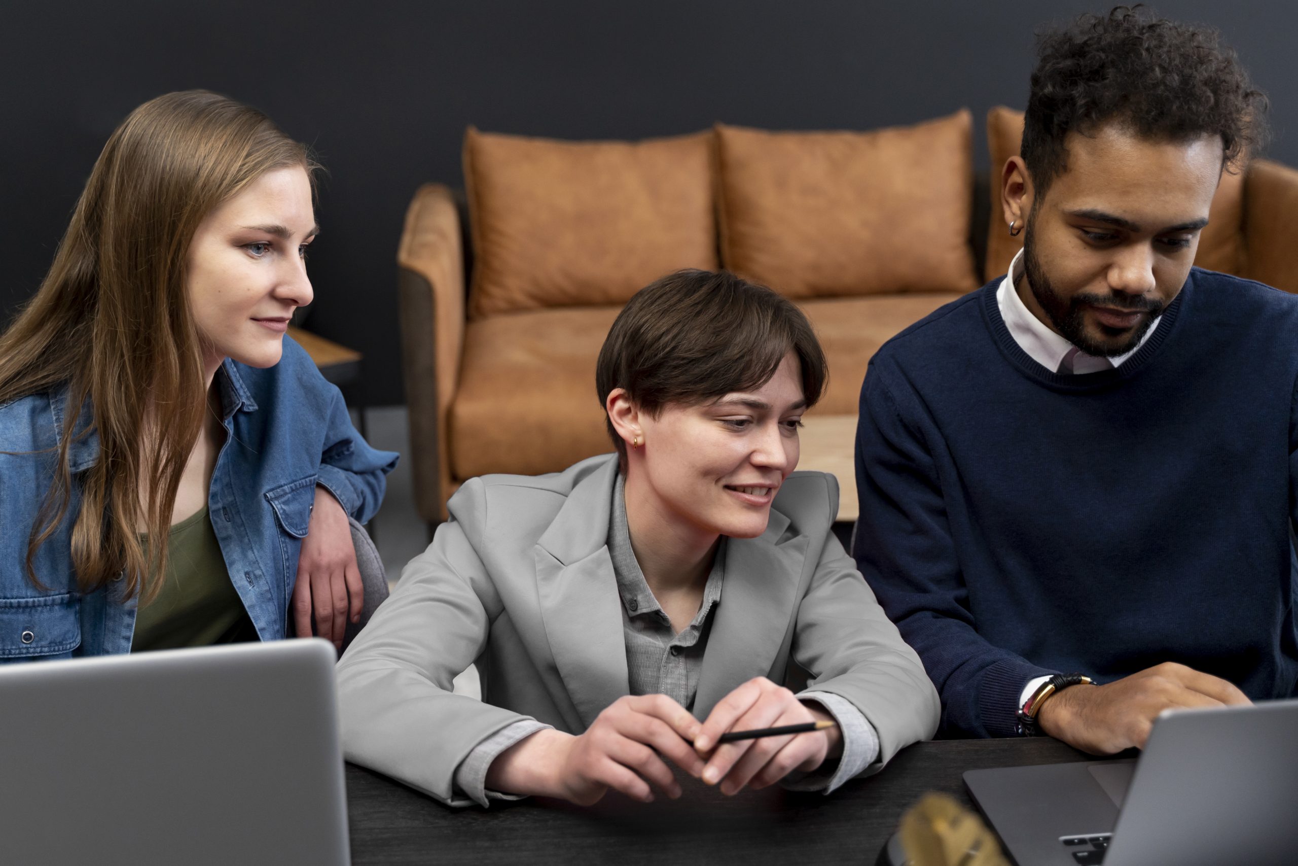 trans-person-working-office-with-colleagues